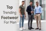 Three stylish men wearing chunky sneakers, sleek Chelsea boots, and classic loafers, standing confidently in a modern city setting.
